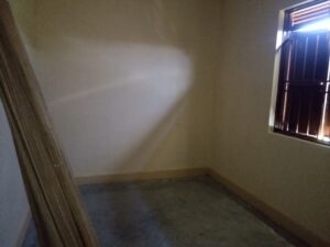 Bishops house - empty internal room with a side window and building material leaning against a wall